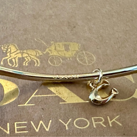 Coach Gold-tone Skinny Bangle Bracelet with Dainty Signature C Dangling Charm. - Picture 6 of 6